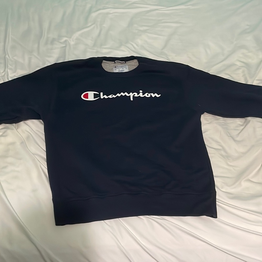 I am currently selling a Navy Blue Champion Crewneck that is Mens Size Medium